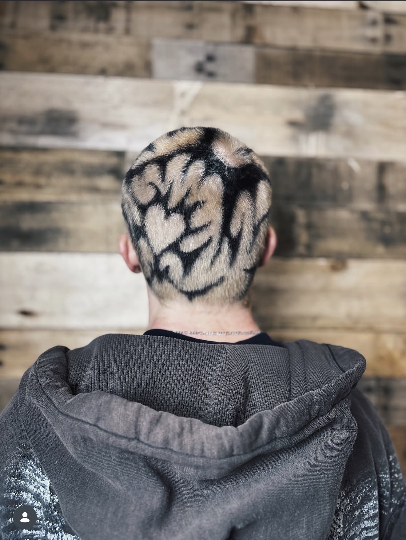 Creative buzz cut with bold black graphic color design