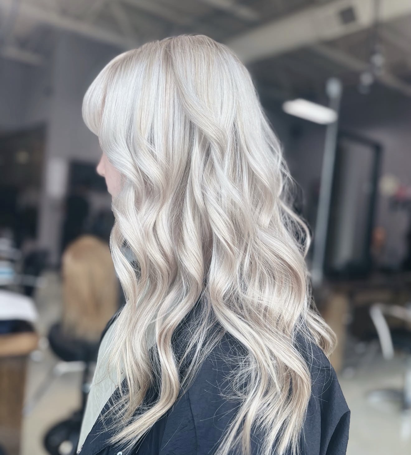 Luminous platinum blonde hair with long soft waves